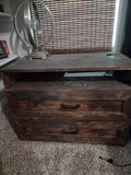 Rustic dark-stained wooden dresser and TV stand with two drawers and an open shelf