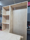 Tall solid pine storage cabinet with open shelves, shown unfinished in the workshop